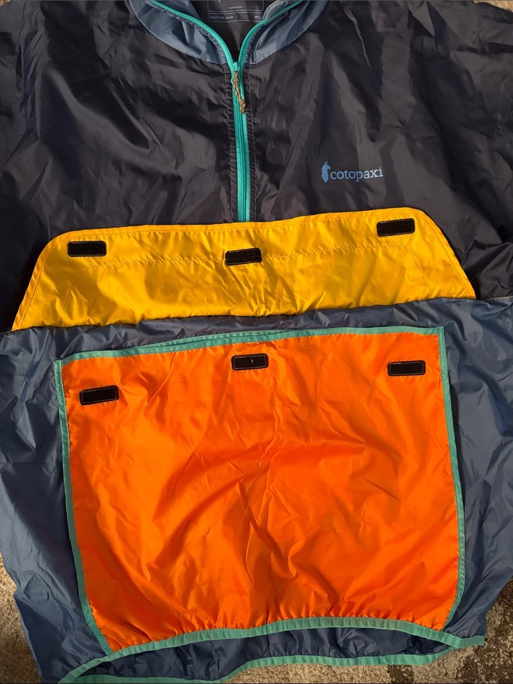 cotopaxi Navy Windbreaker with Orange and Yellow Colorblock